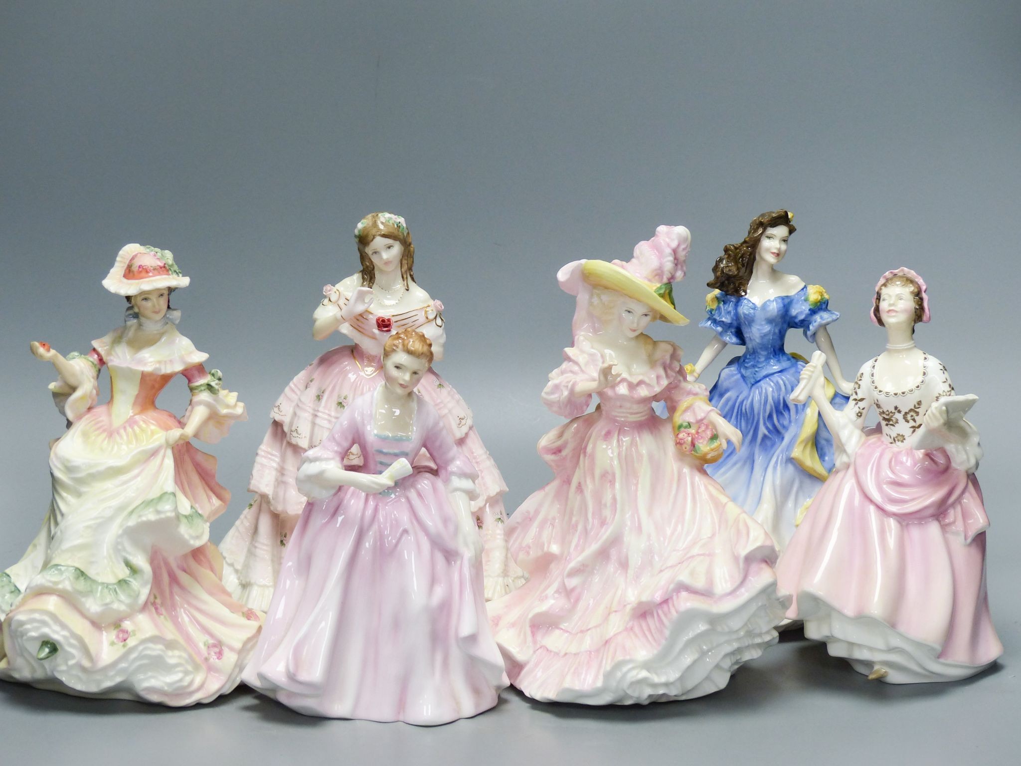 Six Royal Doulton figures: Rebecca HN:4041 Camellias HN:3701 Flowers of Love HN:3709 Red Red Rose HN:3994 Ballad Seller HN:2266 Hostess of Williamsbury HN:2209